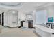 Contemporary bathroom with a standalone tub, glass shower, and modern fixtures under a mosaic tiled ceiling at 361 Benjamin Franklin Dr # A, Sarasota, FL 34236