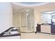 Modern bathroom featuring a glass-enclosed shower, sleek vanity, and unique blue tile accenting the ceiling at 361 Benjamin Franklin Dr # A, Sarasota, FL 34236