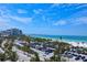 Wide beach with many people enjoys a view of the water in this vibrant scene at 361 Benjamin Franklin Dr # A, Sarasota, FL 34236