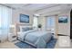 Bright bedroom features a plush bed, modern decor, and a decorative ceiling at 361 Benjamin Franklin Dr # A, Sarasota, FL 34236