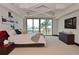 Bedroom with a balcony and an ocean view, complemented by modern furnishings at 361 Benjamin Franklin Dr # A, Sarasota, FL 34236