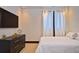 Cozy bedroom with comfortable bed, stylish dresser, and soft lighting, perfect for relaxation at 361 Benjamin Franklin Dr # A, Sarasota, FL 34236