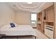 Cozy bedroom with a built-in closet and a window offering natural light, blending comfort and functionality at 361 Benjamin Franklin Dr # A, Sarasota, FL 34236