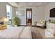 Serene bedroom with a plush bed, soft lighting, and a view into the bathroom at 361 Benjamin Franklin Dr # A, Sarasota, FL 34236