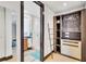 Walk-in closet with custom shelving and storage solutions, adjacent to the bathroom at 361 Benjamin Franklin Dr # A, Sarasota, FL 34236