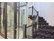 Features a glass elevator and elegant staircase with patterned carpet at 361 Benjamin Franklin Dr # A, Sarasota, FL 34236