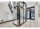 Modern building showcasing a glass elevator, contemporary design, and an open-concept layout, blending luxury and functionality at 361 Benjamin Franklin Dr # A, Sarasota, FL 34236