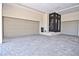 Spacious three-car garage featuring a tiled floor and convenient access to the residence at 361 Benjamin Franklin Dr # A, Sarasota, FL 34236