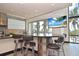 Stylish kitchen with a round island offering bar seating and scenic ocean views at 361 Benjamin Franklin Dr # A, Sarasota, FL 34236