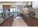 Gourmet kitchen with stainless steel appliances, granite countertops, and custom cabinetry at 361 Benjamin Franklin Dr # A, Sarasota, FL 34236