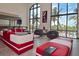 Spacious common area with comfortable seating, large windows offering scenic views of the ocean and palm trees at 361 Benjamin Franklin Dr # A, Sarasota, FL 34236
