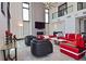 Bright and airy living room with high ceilings, stylish furniture, a fireplace, and large windows at 361 Benjamin Franklin Dr # A, Sarasota, FL 34236
