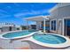 Rooftop deck boasts dual hot tubs, covered seating, and panoramic city views at 361 Benjamin Franklin Dr # A, Sarasota, FL 34236