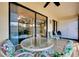 Screened patio with seating area, perfect for relaxing outdoors at 744 White Pine Tree Rd # 103, Venice, FL 34285