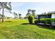 Backyard with well-manicured lawn and view of the golf course at 266 Cerromar S Way # 55, Venice, FL 34293
