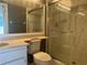 Bathroom featuring a shower, toilet, single sink vanity, and large mirror at 266 Cerromar S Way # 55, Venice, FL 34293
