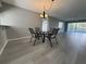 Open dining room area with wood floors and natural light at 266 Cerromar S Way # 55, Venice, FL 34293