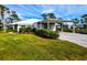 Charming single-story home with well-manicured lawn and a covered carport at 266 Cerromar S Way # 55, Venice, FL 34293