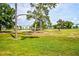 Scenic view of the golf course, pond, and mature trees surrounding the Augusta Villas community at 266 Cerromar S Way # 55, Venice, FL 34293