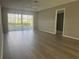 Spacious living room with wood floors and lots of natural light at 266 Cerromar S Way # 55, Venice, FL 34293