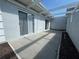 Concrete patio with wood pergola at 266 Cerromar S Way # 55, Venice, FL 34293