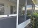 Enclosed screened porch featuring sliding glass door and a protective screen to keep out pests at 266 Cerromar S Way # 55, Venice, FL 34293