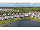 Aerial view of community with lake at 19728 Tortuga Cay Dr, Venice, FL 34293