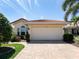 Single-story home with attached garage and well-manicured landscaping at 205 Mestre Pl, North Venice, FL 34275