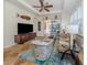 Spacious living room with comfy seating, large TV, and access to patio at 205 Mestre Pl, North Venice, FL 34275