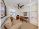 Home office features built-in shelving and a comfortable sitting area at 205 Mestre Pl, North Venice, FL 34275