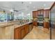 Eat-in kitchen with stainless steel appliances and ample wood cabinetry at 205 Mestre Pl, North Venice, FL 34275