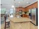 Kitchen features granite countertops, stainless steel appliances, and breakfast bar at 205 Mestre Pl, North Venice, FL 34275
