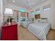 Guest bedroom with twin beds and plenty of natural light at 205 Mestre Pl, North Venice, FL 34275