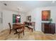 Formal dining room features hardwood floors and decorative artwork at 205 Mestre Pl, North Venice, FL 34275