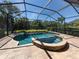Screened pool and spa with ample deck space at 205 Mestre Pl, North Venice, FL 34275