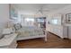 Bright bedroom with king-size bed, wood flooring and access to balcony at 601 Shreve St # 51B, Punta Gorda, FL 33950