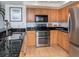 Bright kitchen boasts granite countertops and stainless steel appliances at 601 Shreve St # 51B, Punta Gorda, FL 33950