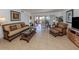 Bright and airy living room with wicker furniture and tile floors at 601 Shreve St # 51B, Punta Gorda, FL 33950