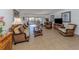 Bright and airy living room with wicker furniture and tile floors at 601 Shreve St # 51B, Punta Gorda, FL 33950