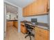 Home office with built-in desk and cabinets, plus a view to the bathroom at 601 Shreve St # 51B, Punta Gorda, FL 33950