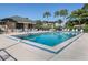 Community pool and adjacent patio area with tables at 601 Shreve St # 51B, Punta Gorda, FL 33950