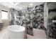 Luxurious bathroom with a spacious soaking tub and a walk-in shower with marble tile at 2340 Bayshore Rd, Nokomis, FL 34275
