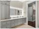 Vanity with gray cabinets and a quartz countertop in a modern bathroom at 2340 Bayshore Rd, Nokomis, FL 34275