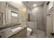 Bathroom with single sink vanity, toilet and walk-in shower at 2340 Bayshore Rd, Nokomis, FL 34275