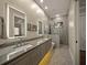Elegant bathroom with double sinks, granite countertop, and a large walk-in shower at 2340 Bayshore Rd, Nokomis, FL 34275