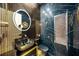 Modern bathroom with black and gold finishes at 2340 Bayshore Rd, Nokomis, FL 34275