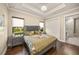 Bright bedroom with king-size bed and en-suite bathroom at 2340 Bayshore Rd, Nokomis, FL 34275