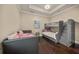 Bedroom with bunk beds, a daybed, and hardwood floors at 2340 Bayshore Rd, Nokomis, FL 34275