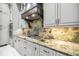 Modern kitchen with granite countertops and stainless steel appliances at 2340 Bayshore Rd, Nokomis, FL 34275