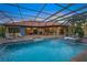 Inviting pool and spa with a covered patio and outdoor seating area at 2340 Bayshore Rd, Nokomis, FL 34275